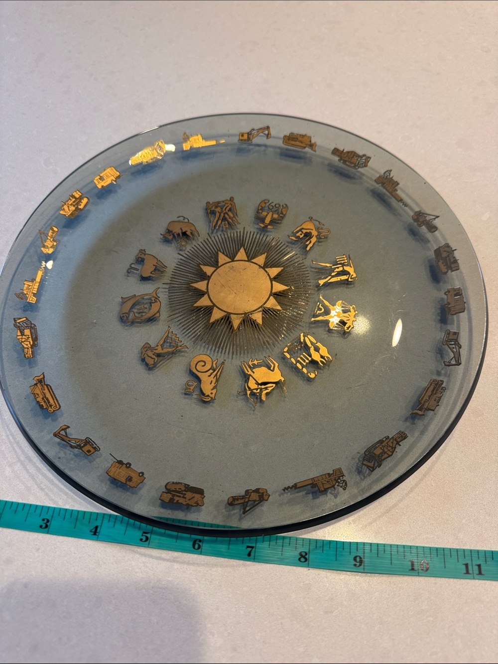 Glass Decorative Plate with Gold Zodiac Accents and heavy equipment